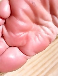 Mature and younger women engaging in lesbian activities