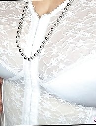 Hot mature brunette shows off her pantyhose clad pussy by lifting her skirt